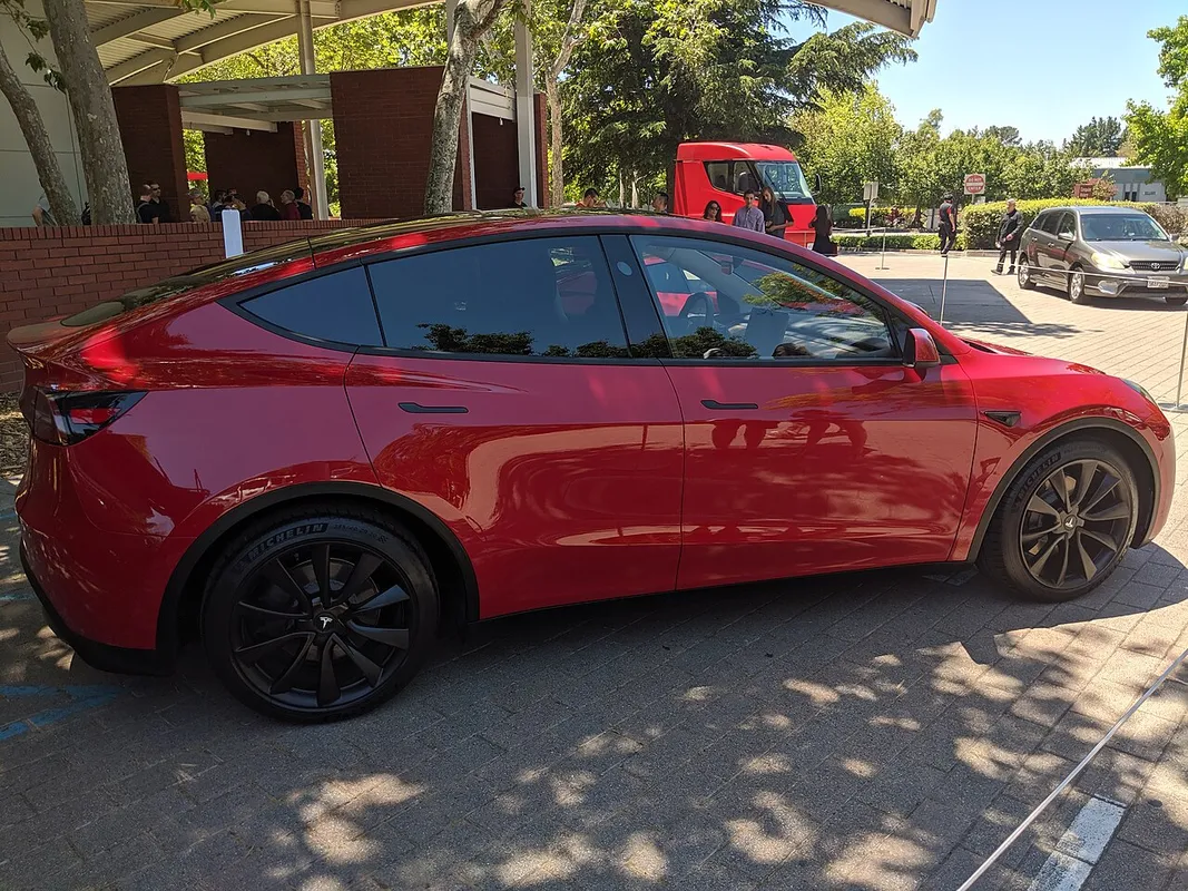 Tesla Model Y photographed from the passenger side at an investor conference
