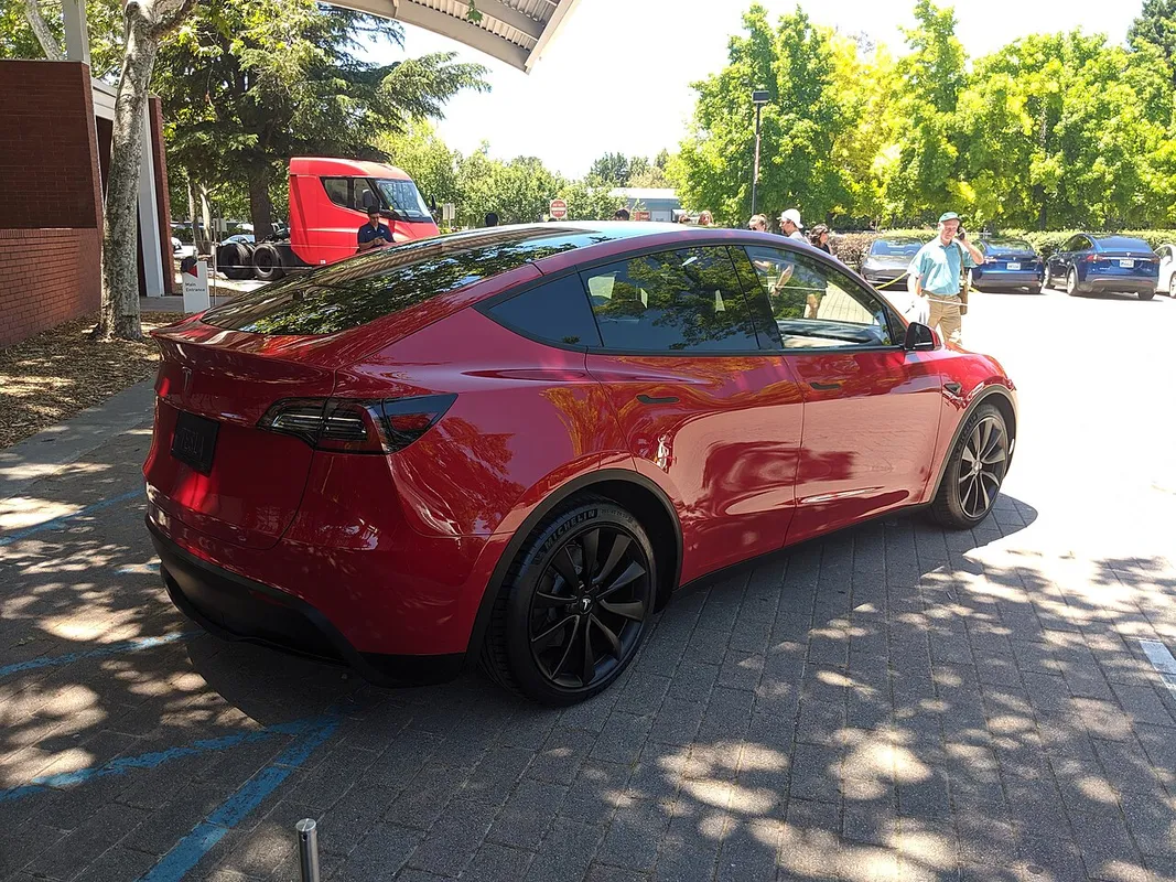 Tesla Model Y photographed from the rear passenger side at an investor conference