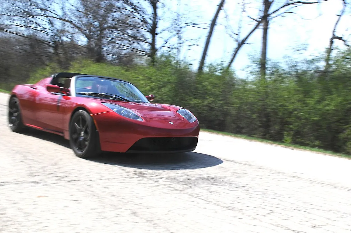 Argonne National Laboratory engineers evaluating an electric Tesla Roadster at the Advanced Powertrain Research Facility